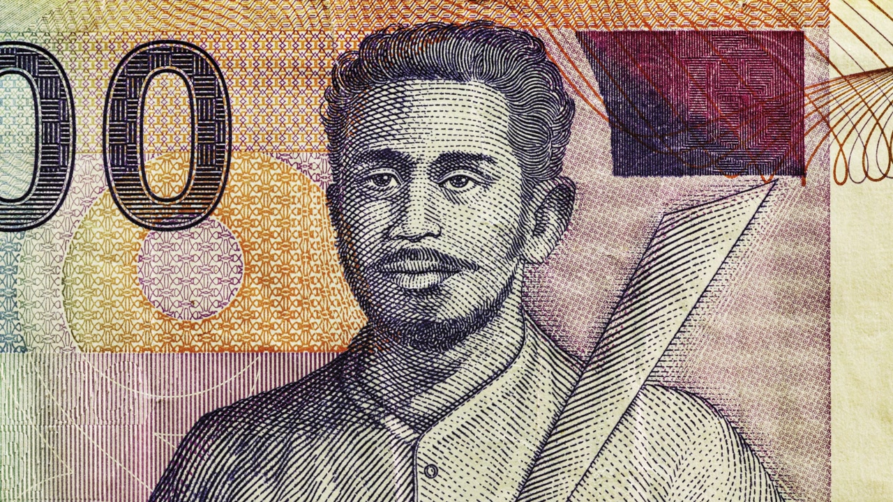 Close pan across Indonesian 1000 rupiah note showing portrait and patterns