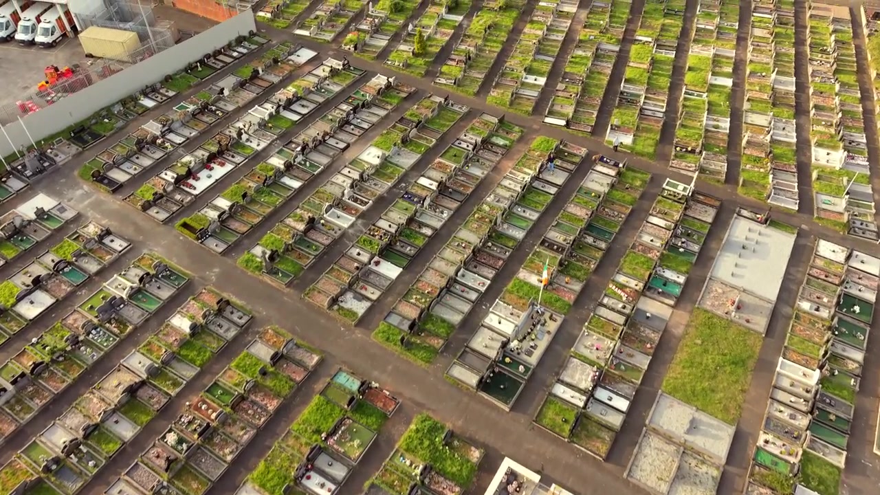 Top-down 4K 60FPS aerial video of Milltown Cemetary and the Irish Republican Plot on the Falls Road in Belfast, Northern Ireland, UK. Produced with broadcast ready Rec709 color.