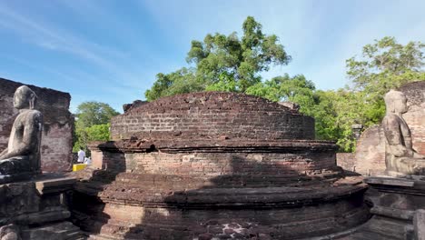 buddha statues and stupa inside polonnaruwa vatadage, showcasing ancient architecture from the kingdom of polonnaruwa in sri lanka. slow motion, pan right
