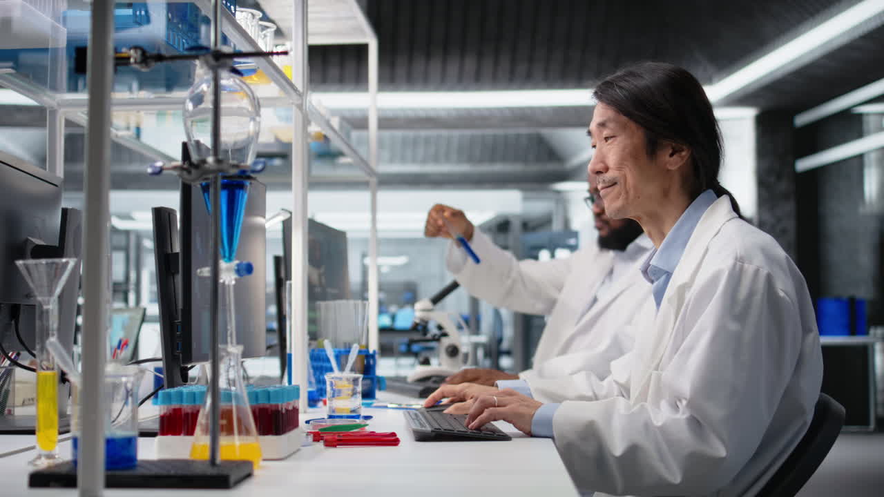 Vertical video Laboratory scientist looks for DNA genomic variation in genetic markers using PC