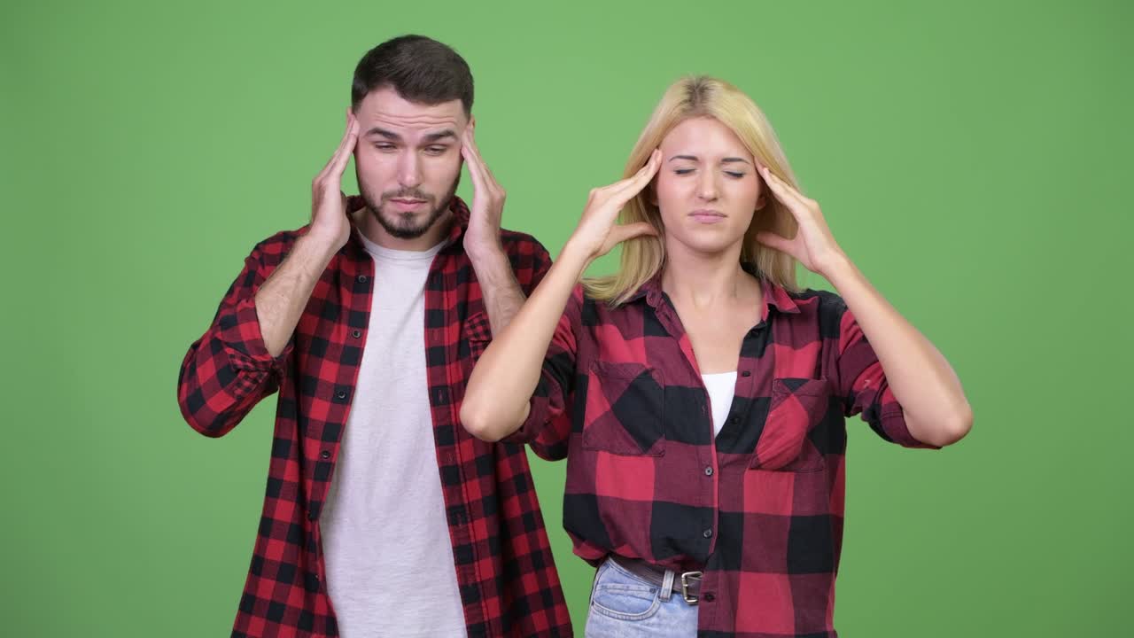 Young couple having headache together