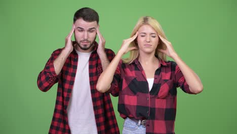 young couple having headache together