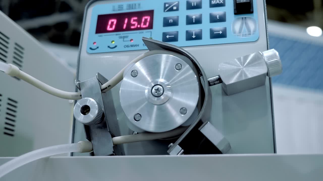 In the laboratory, a transparent solution is pumped through a silicone tube