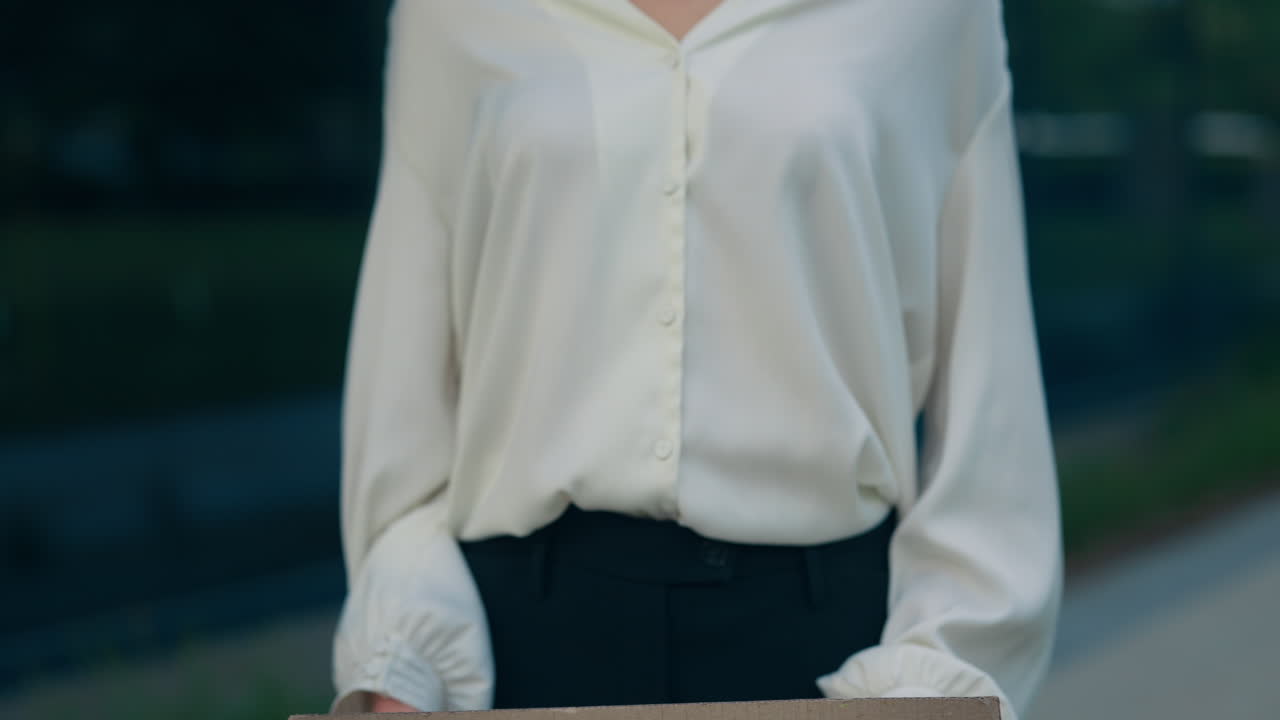 Person Holding a Cardboard Sign Saying "I Need Job"