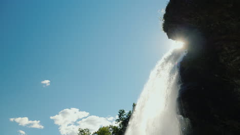 The-Sun-Shines-Through-Steinsdalsfossen-Waterfall-In-Norway-4k-Video