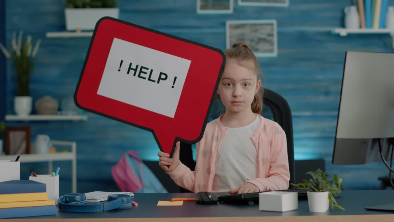 Young child holding speech bubble and asking for help