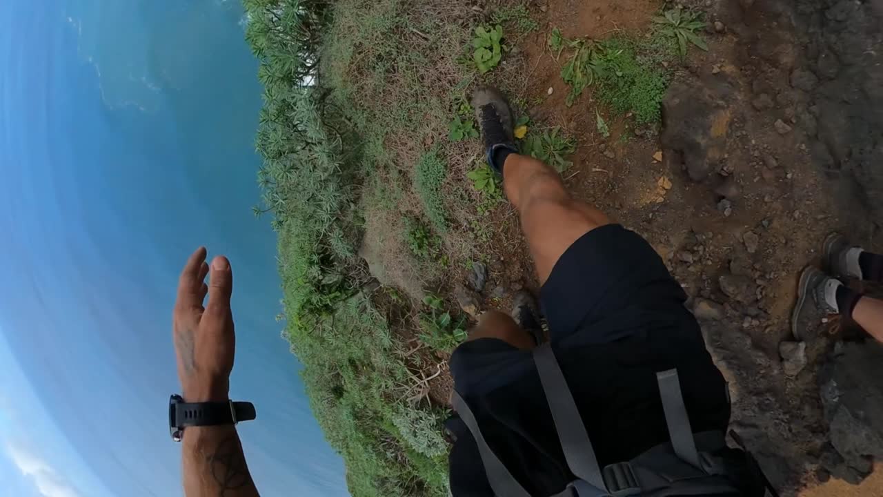 POV shot of a man walking fast down the path on the edge of Quebrada do Negro in Madeira