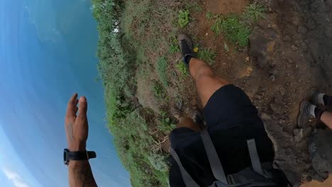 pov shot of a man walking fast down the path on the edge of quebrada do negro in madeira