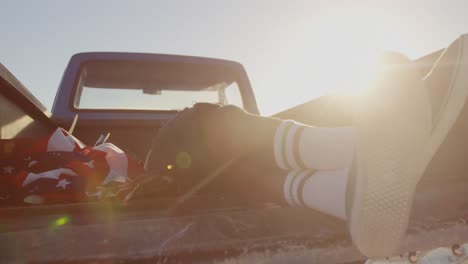 Man-relaxing-in-pickup-truck-at-beach-4k