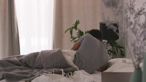 person in bed in bedroom