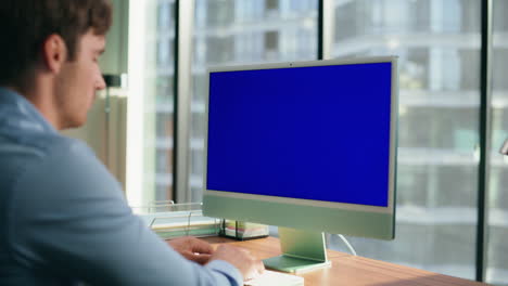 zoom on ceo looking mockup computer office. executive typing blue screen device