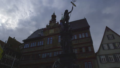 moody statue in am markt, inside the main square of market place in the old town of tubingen germany, europe
