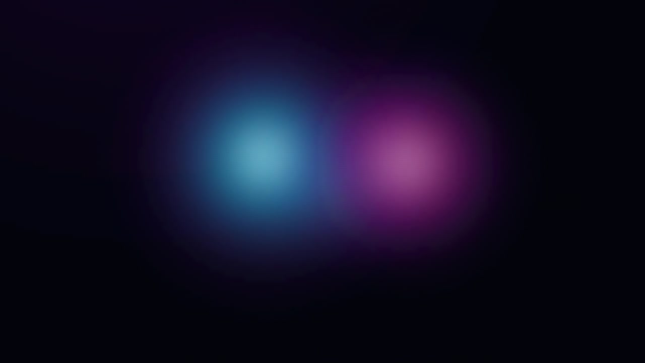 Abstract Motion of Glowing Pink and Blue Light Orbs