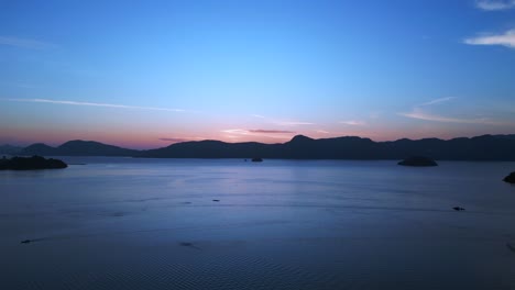 colorful hues over the ocean, islands before sunrise