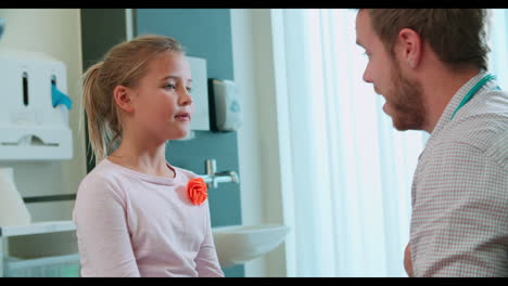 pediatric doctor examining girl in surgery