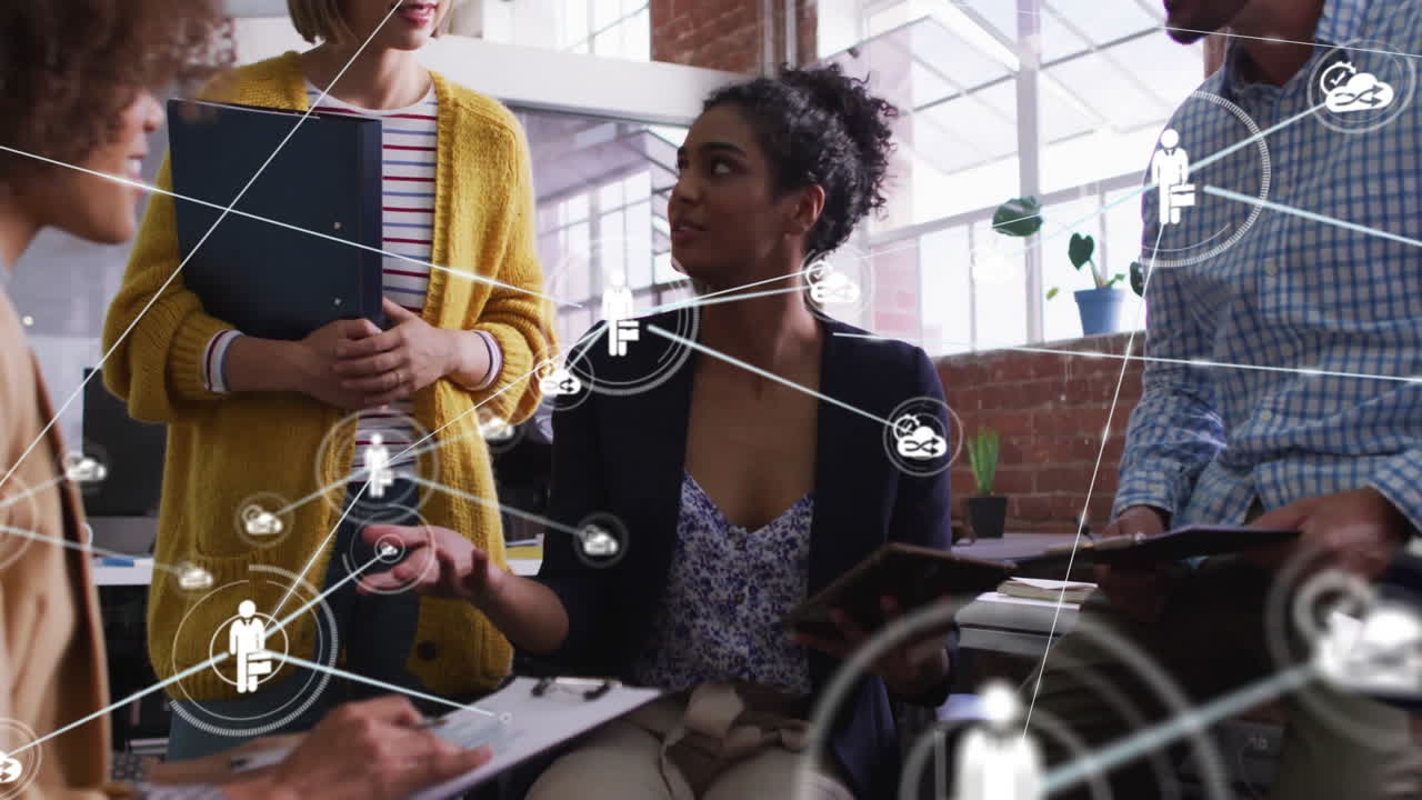 Animation of network of connections with people icons over diverse business people in office