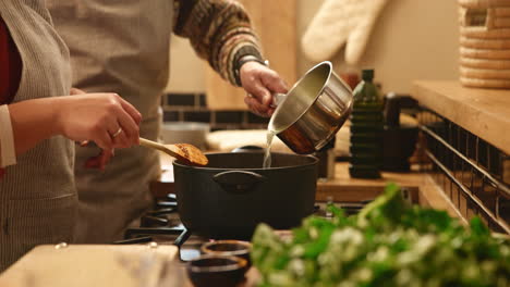 couple cooking together in the kitchen