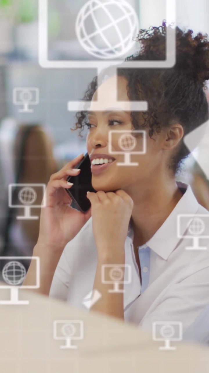 Animation of globe icons and data processing over businesswoman in office
