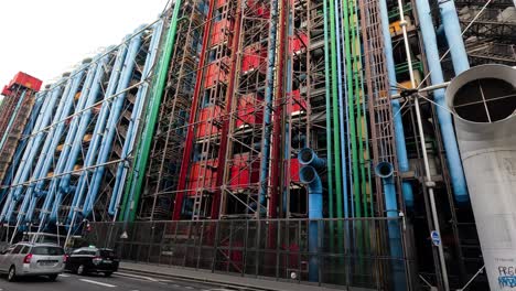 vehicles passing by the colorful centre pompidou