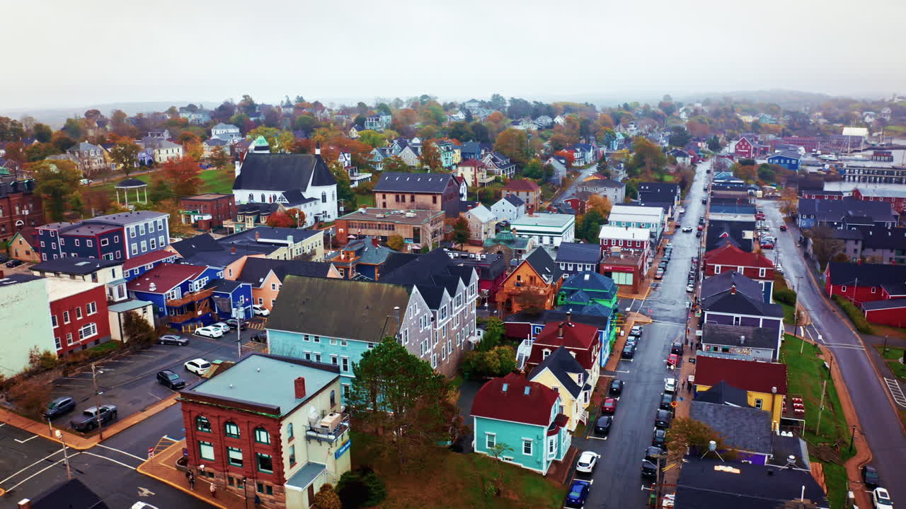 Aerial drone shot over the local town of Lunenburg in Nova Scotia, Canada. Fishing lobster town. Foggy misty day.