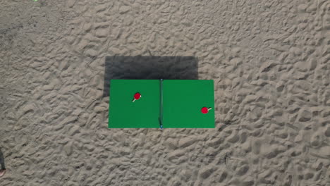 Rising-aerial-view-of-an-isolated-table-tennis-table-on-the-beach