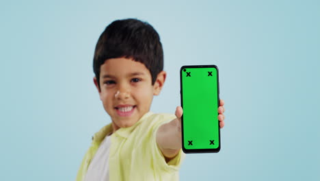 Kid,-face-or-phone-green-screen-in-studio