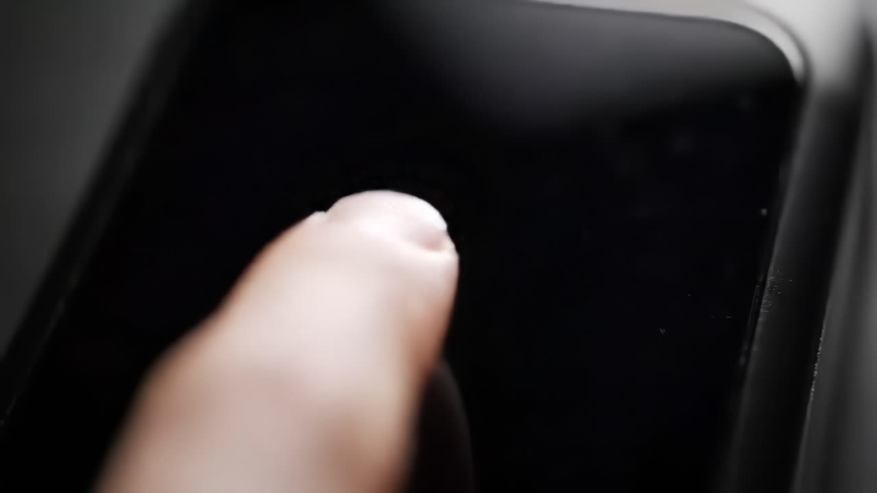 Demonstration of a finger scanning device that captures fingerprints for secure access. This innovative technology enhances security in various applications.