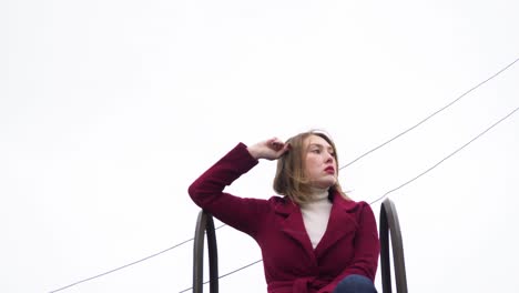 woman in red coat outdoors