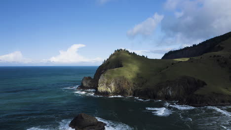 Aerial-View-Of-Coastal-Cliff-Overlooking-Turquoise-Ocean-At-God's-Thumb-Region,-Oregon-Coast-USA