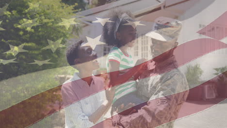 animation of african american male soldier embracing smiling daughter over american flag