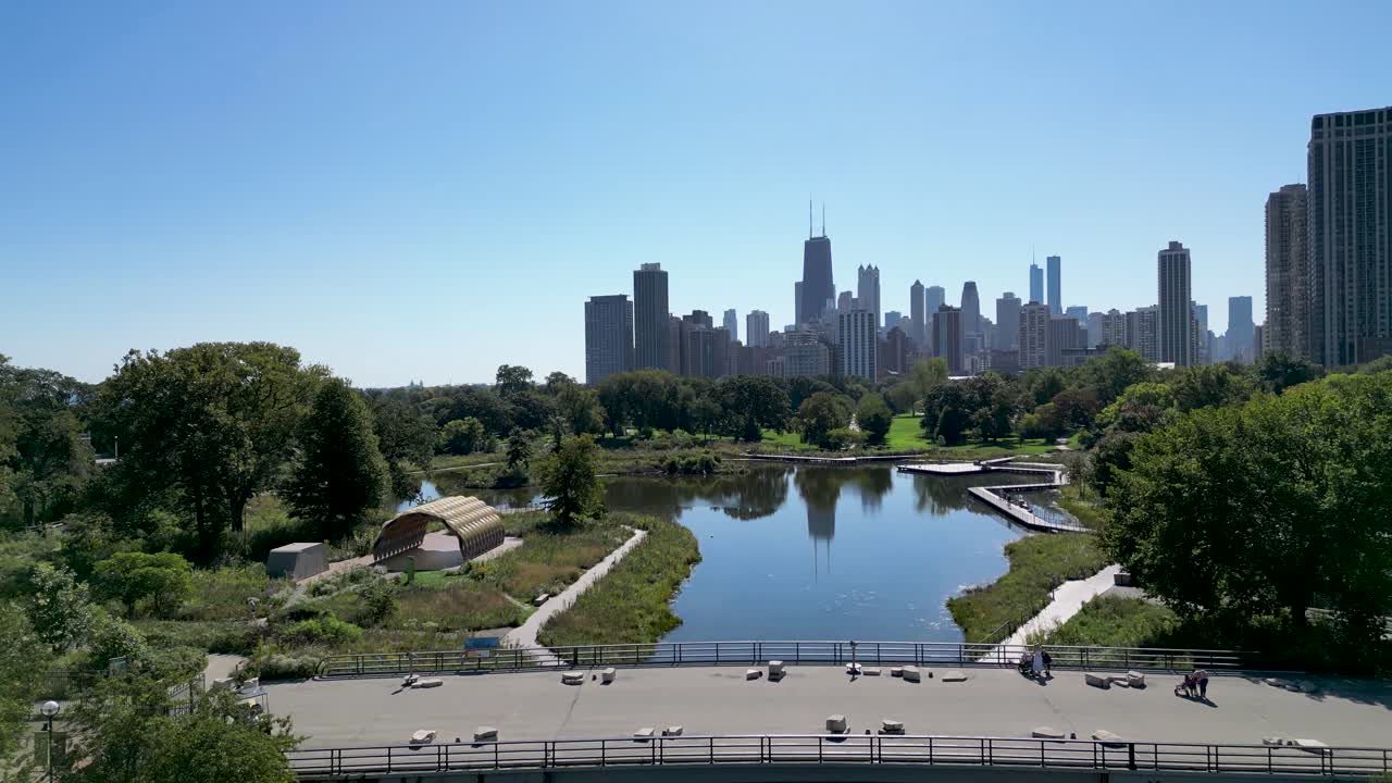 High resolution beautiful panoramic aerial drone 4K video of Lincoln Zoo Chicago and Chicago's skyline and its surrounding area