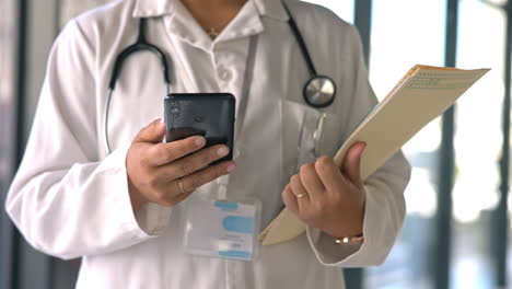 medical, phone and text with hands of doctor