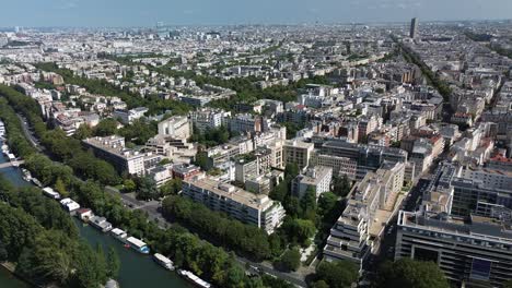 buildings in modern neighborhood along seine, paris cityscape, france