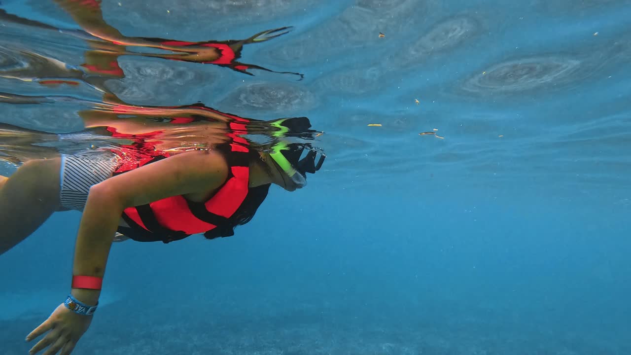 Woman snorkeling in Caribbean waters in Cancun