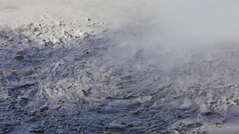 boiling hot geothermal volcanic mud pool, closeup shot