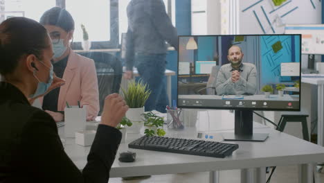 freelancer wearing protective face mask during online videocall