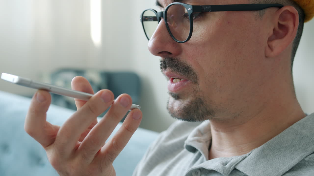 Man using voice command on a smartphone