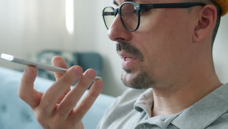 man using voice command on a smartphone