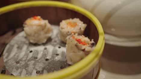 steamed shrimp dumplings (har gow) in a bamboo steamer