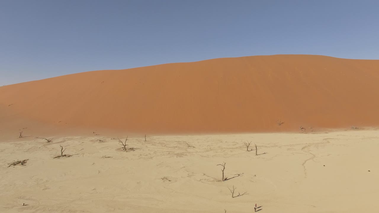 Aerial view of a big dune and the dried land around at Deadvlei in Namib Desert, Namibia