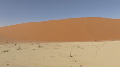 aerial view of a big dune and the dried land around at deadvlei in namib desert, namibia