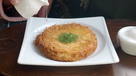 kunafa turkish dessert with syrup and pistachios