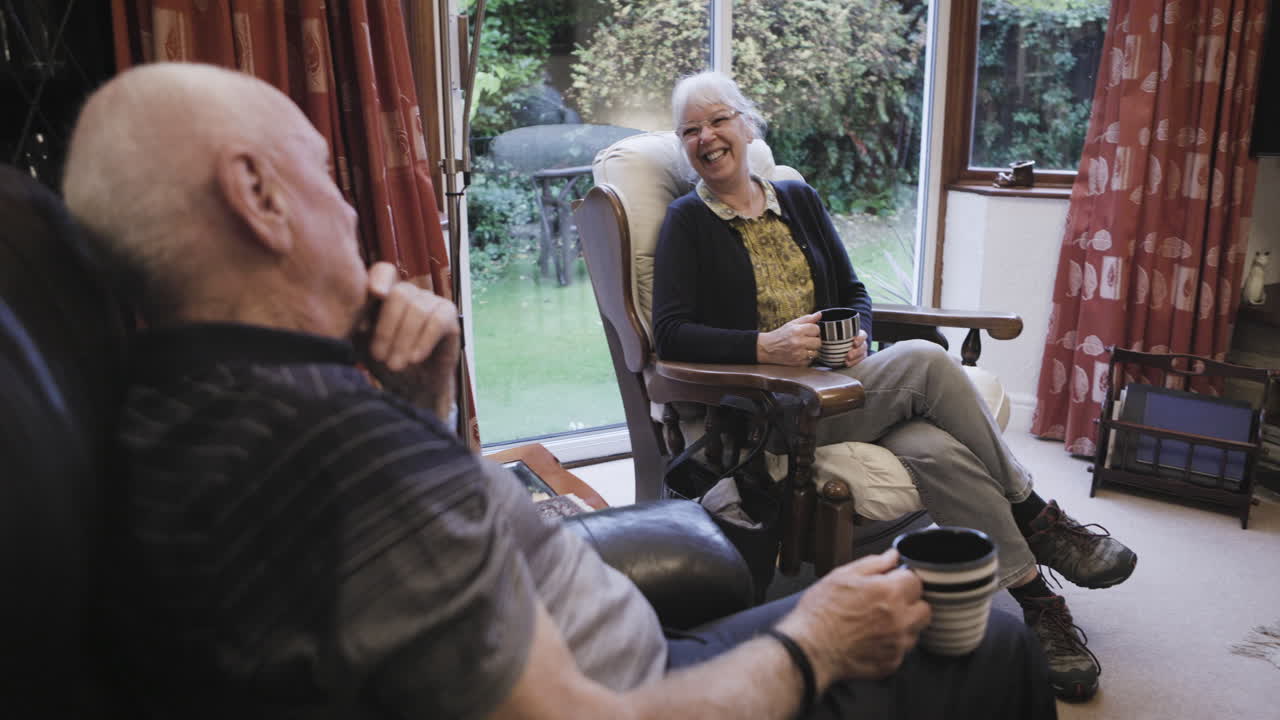 Elderly couple relaxing at home