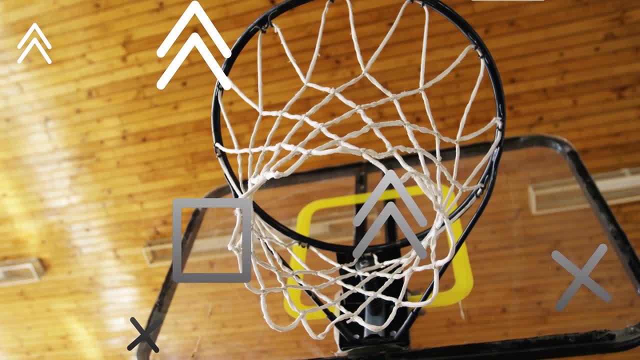 Camera tilting up, rim and net swinging while overlays drifting to reveal backboard support