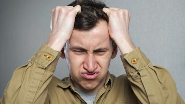 Depressed young man feels stressed and desperate.
