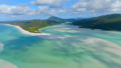 Drone-flying-toward-whitehaven-beach,-Whitsunday-island-Austraia