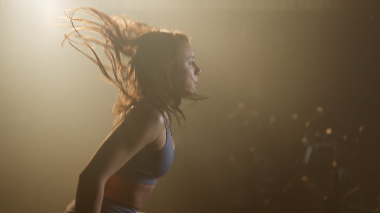 A woman is doing exercise in gym