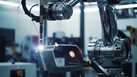 automated welding process: a robotic arm executes precision welding with high-quality techniques in a high-tech industrial environment