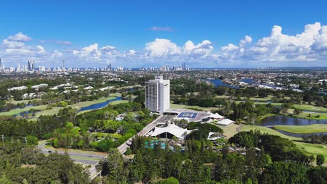 scenic aerial view of golf course and cityscape
