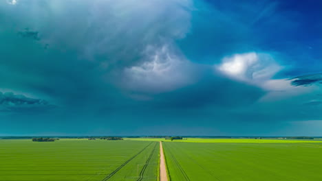 cloudburst rainstorm over cornfields in the heartland - aerial hyper lapse